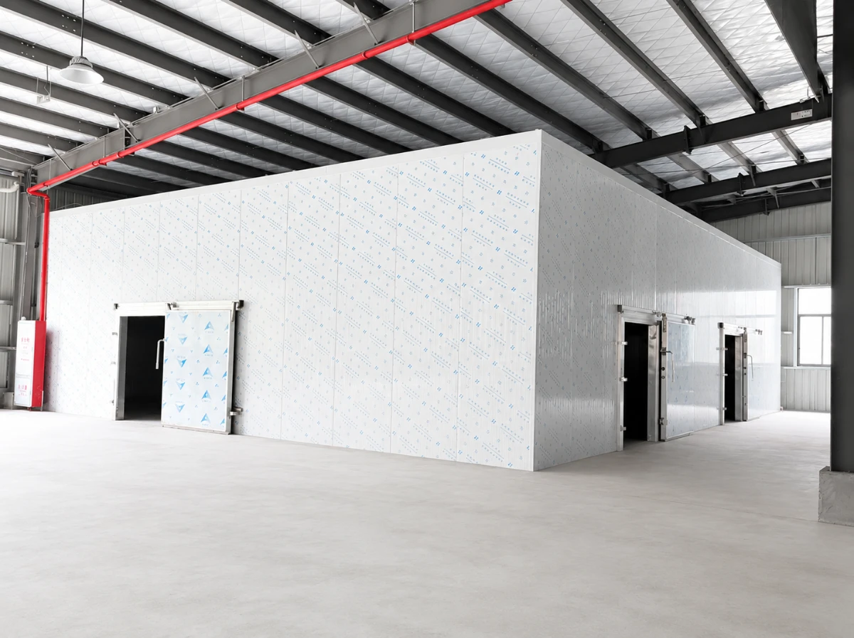 Modular cold room built from insulated panels inside a steel structure building, with insulated sliding doors