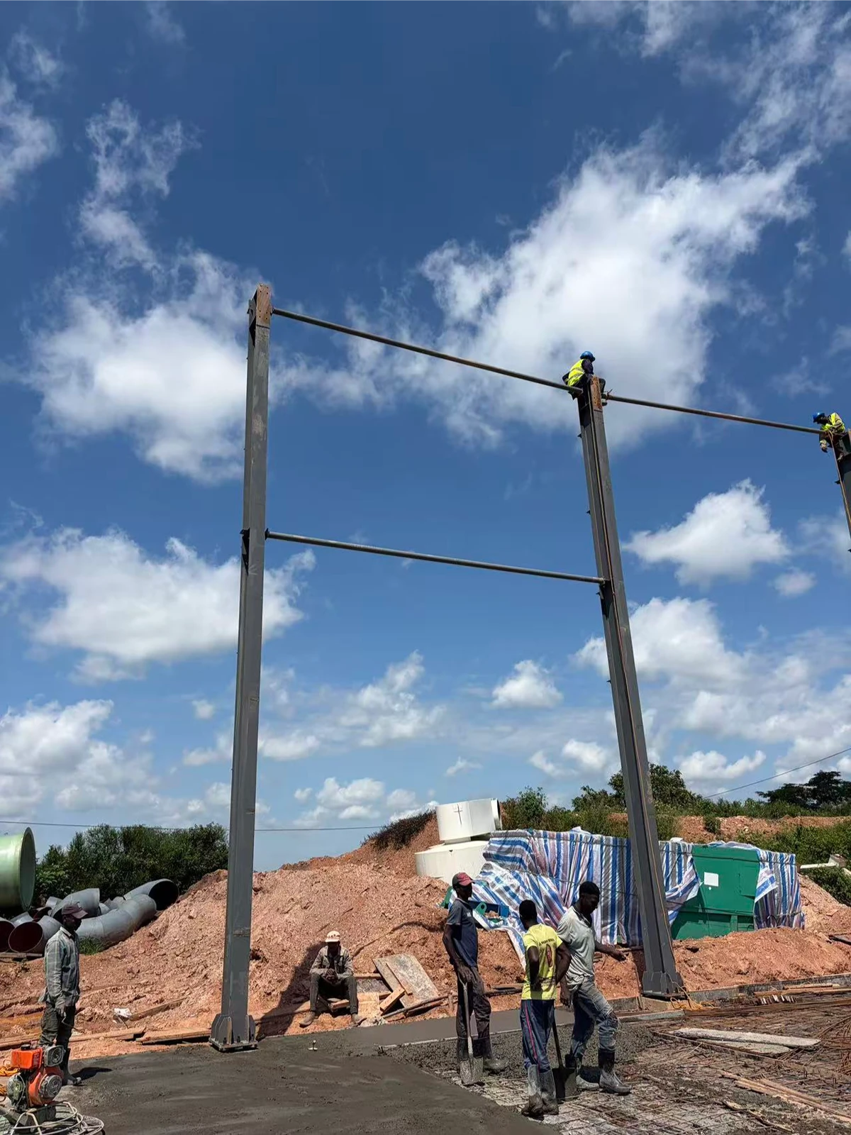 Workers performing precision fabricated bolt accuracy connection work at height on steel frame