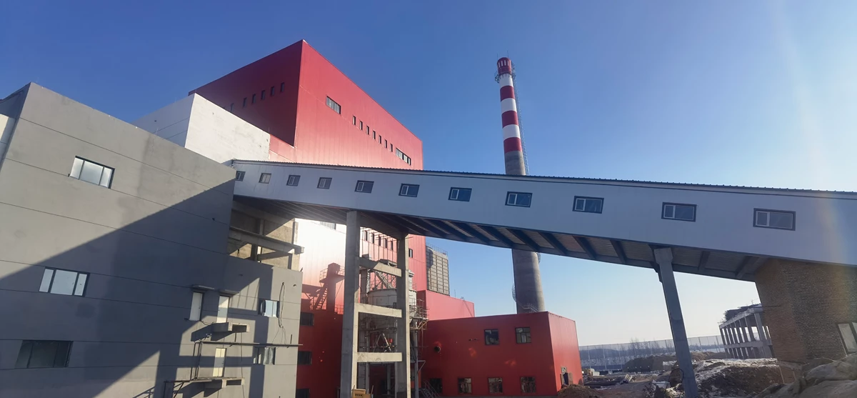 Elevated steel pipe rack and conveyor gallery connecting industrial buildings on a Vikkins project